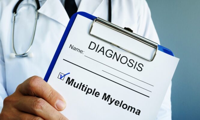 Doctor is holding diagnosis Multiple myeloma. Doctor